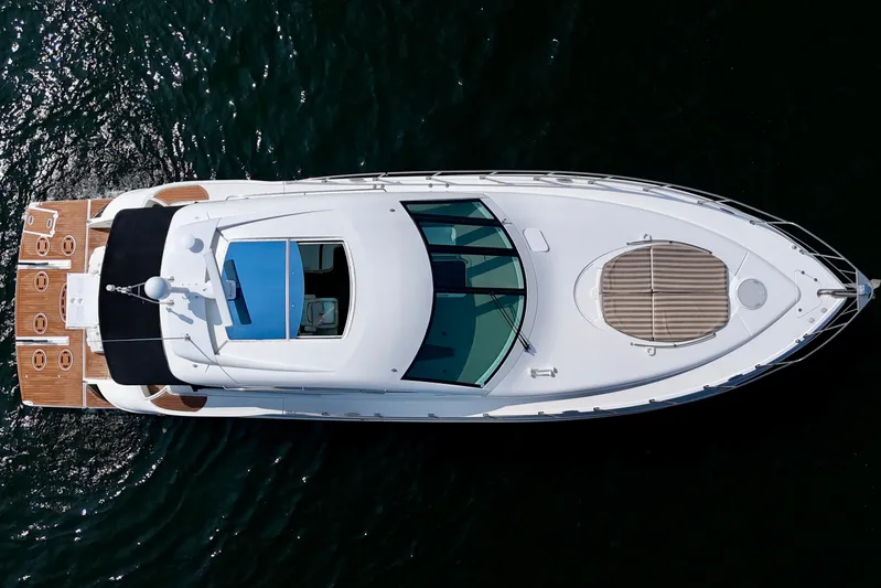  Yacht Photos Pics 2012 Cruisers Yachts 540 Sports Coupe, aerial view on water.