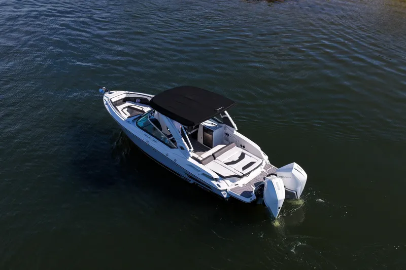  Yacht Photos Pics 2023 Monterey 305SS Super Sport boat cruising on calm water.