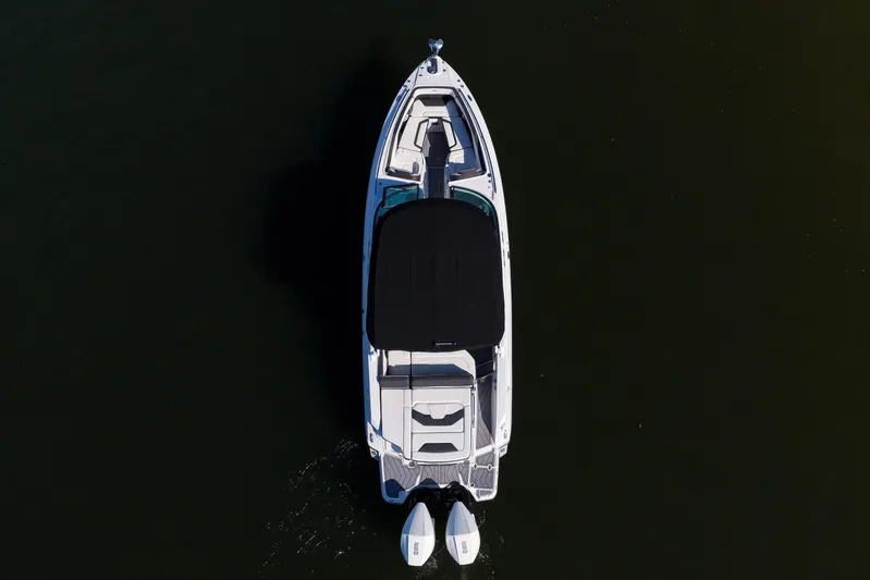  Yacht Photos Pics Aerial view of 2023 Monterey 305SS Super Sport boat on dark water.