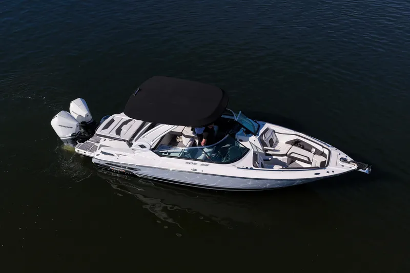  Yacht Photos Pics 2023 Monterey 305SS Super Sport boat on water, featuring sleek design and dual engines.