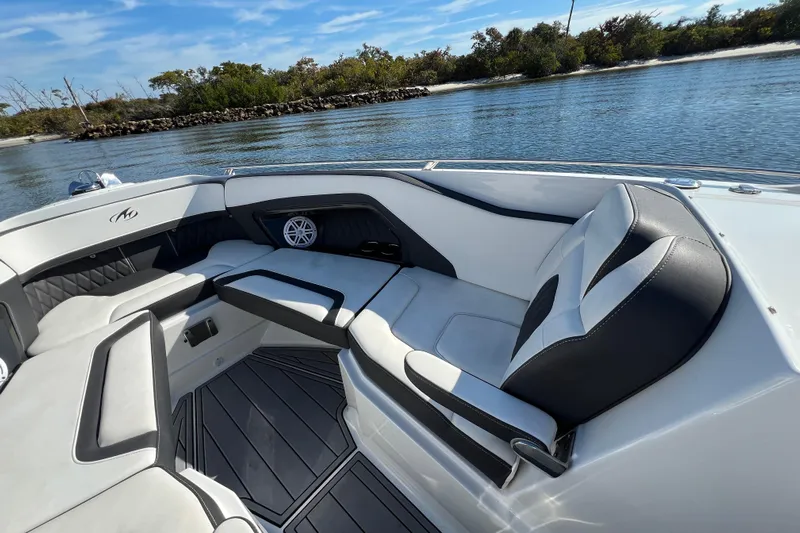  Yacht Photos Pics 2023 Monterey 305SS Super Sport boat interior with luxurious seating and scenic water view.