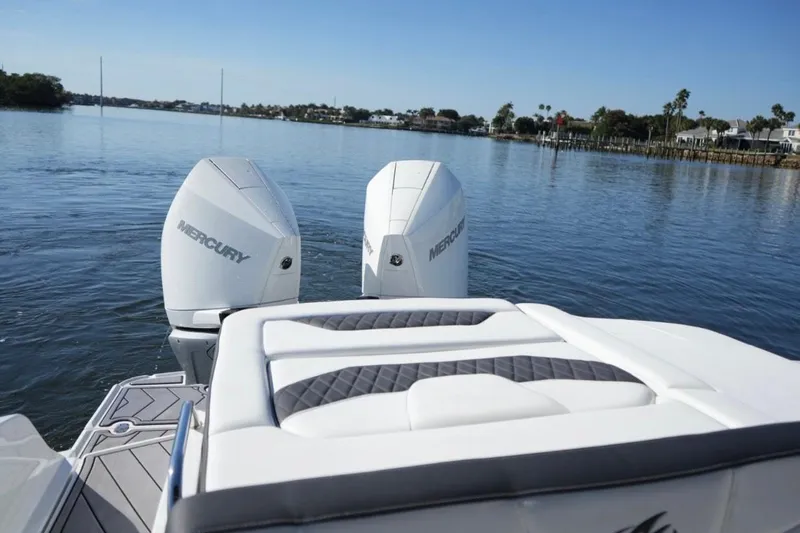  Yacht Photos Pics 2023 Monterey 305SS Super Sport boat with dual Mercury engines on a calm lake.