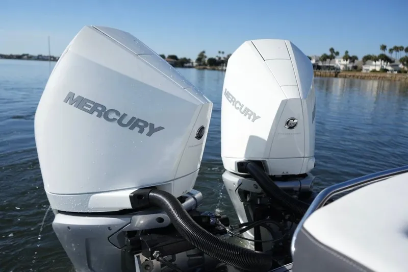  Yacht Photos Pics 2023 Monterey 305SS Super Sport with dual Mercury outboard engines on a calm lake.