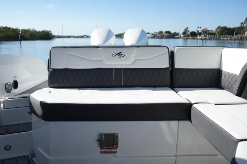  Yacht Photos Pics 2023 Monterey 305SS Super Sport boat interior with luxurious seating and scenic water view.