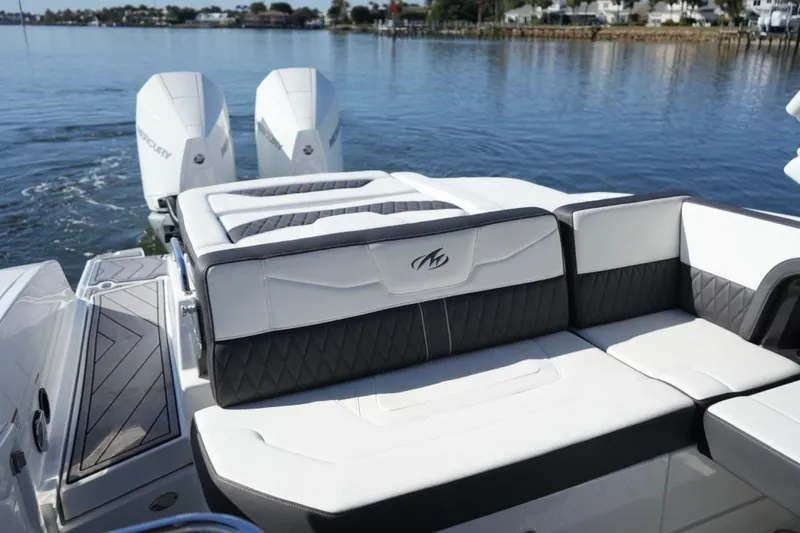  Yacht Photos Pics 2023 Monterey 305SS Super Sport boat with luxurious seating and dual outboard engines.