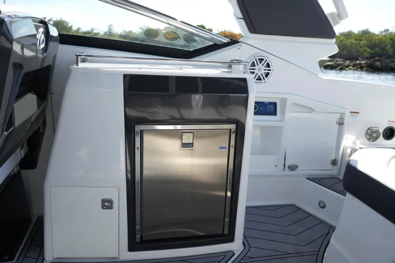  Yacht Photos Pics 2023 Monterey 305SS Super Sport boat interior with sleek stainless steel features.