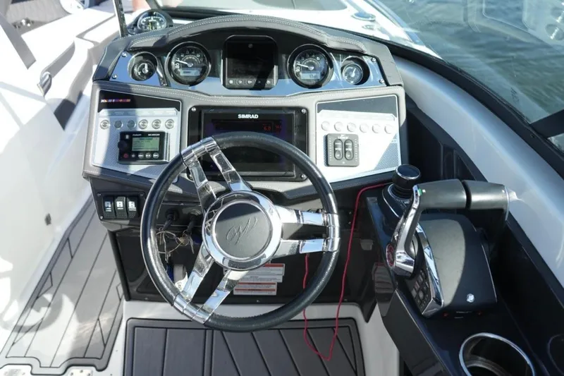  Yacht Photos Pics Cockpit of 2023 Monterey 305SS Super Sport boat with modern controls and steering wheel.