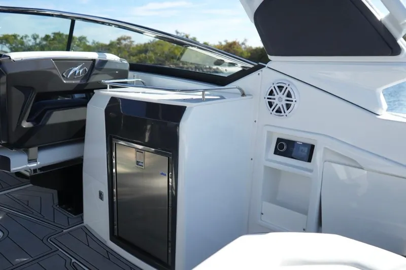  Yacht Photos Pics 2023 Monterey 305SS Super Sport boat interior with sleek seating and modern amenities.