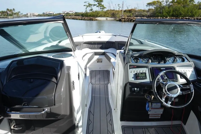  Yacht Photos Pics 2023 Monterey 305SS Super Sport boat interior with sleek dashboard and open seating area.