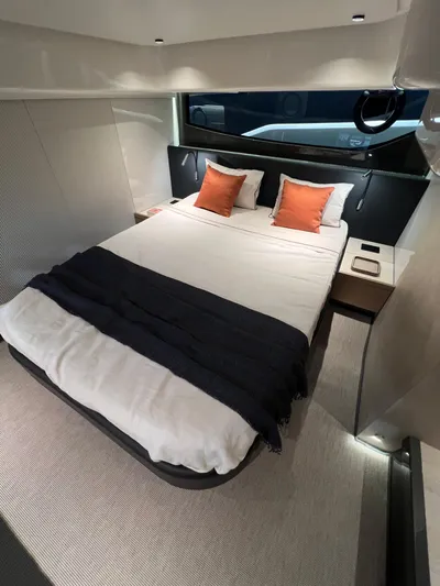  Yacht Photos Pics Luxurious bedroom in 2025 FIM 440 Regina yacht with modern decor and cozy bedding.