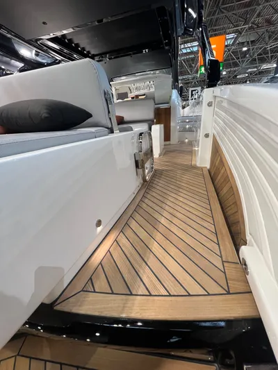  Yacht Photos Pics 2025 FIM 440 Regina boat interior with sleek wood flooring and modern seating.