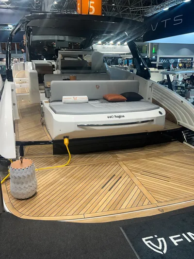  Yacht Photos Pics 2025 FIM 440 Regina luxury yacht with spacious deck at a boat show.