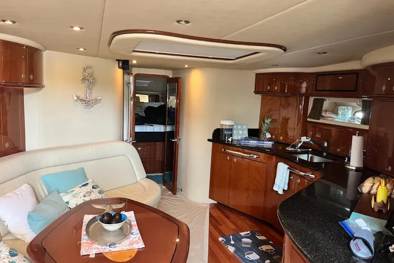 Skyjacked Yacht Photos Pics Luxurious interior of a 2003 Sea Ray 550 Sundancer yacht with elegant wood finishes.