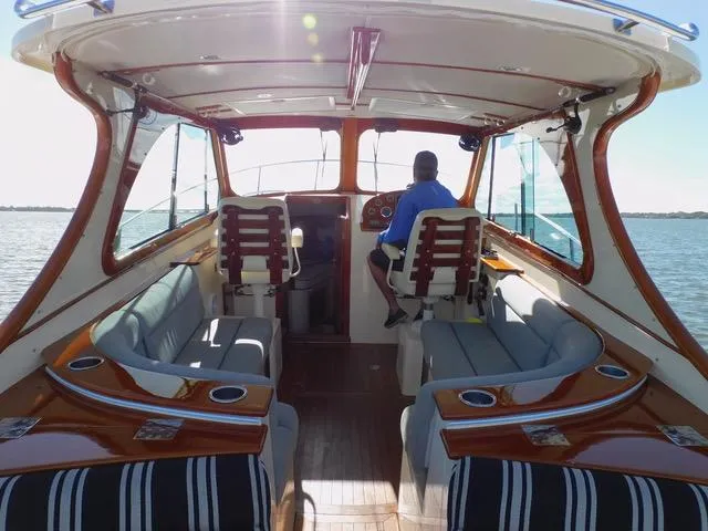  Yacht Photos Pics Interior of 2013 Hinckley T34 yacht with elegant seating and wood finishes.