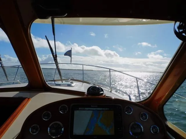  Yacht Photos Pics View from 2013 Hinckley T34 yacht cockpit, navigating sunny ocean waters.