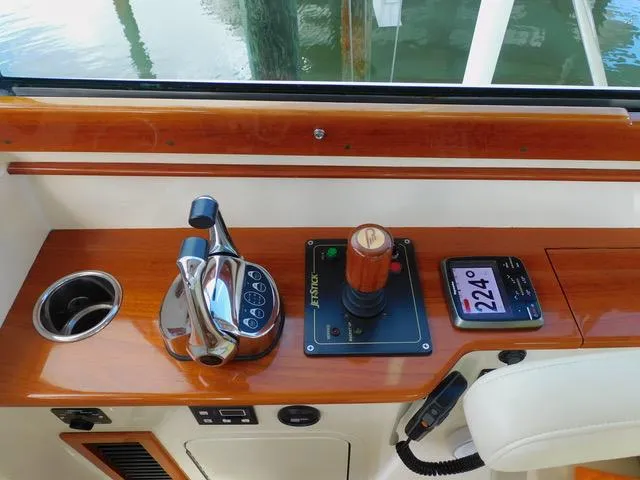  Yacht Photos Pics Hinckley T34 2013 boat controls with wooden finish and navigation display.
