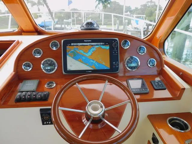  Yacht Photos Pics Hinckley T34 2013 helm with navigation system and wooden steering wheel.
