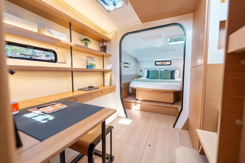  Yacht Photos Pics Manufacturer Provided Image: Modern interior of 2026 Excess 13 yacht with cozy bedroom and workspace.