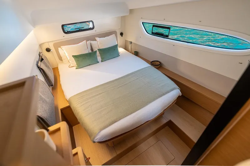  Yacht Photos Pics Manufacturer Provided Image: Luxurious cabin interior of 2026 Excess 13 yacht with cozy bed and ocean view.