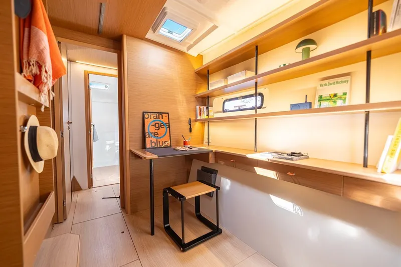 Yacht Photos Pics Manufacturer Provided Image: Modern interior of Excess 13 yacht, 2026 model, featuring a stylish workspace and shelving.