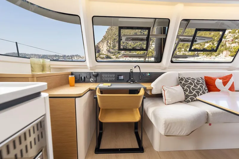  Yacht Photos Pics Manufacturer Provided Image: Luxurious interior of 2026 Excess 13 yacht with modern seating and scenic windows.