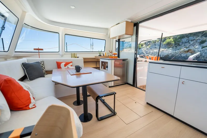  Yacht Photos Pics Manufacturer Provided Image: Modern interior of 2026 Excess 13 yacht with stylish seating and panoramic windows.