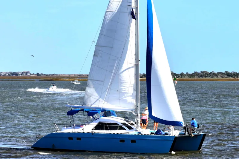 Freedom Yacht Photos Pics Blue Lagoon 42 catamaran sailing on a sunny day, 1993 model.