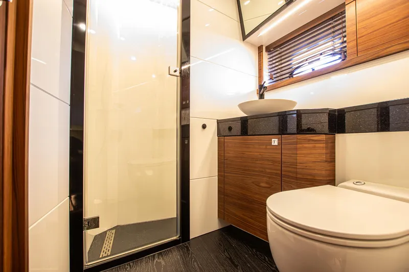  Yacht Photos Pics Luxurious bathroom in 2021 Van der Heijden Exclusive de Luxe 1600 yacht, featuring modern fixtures.