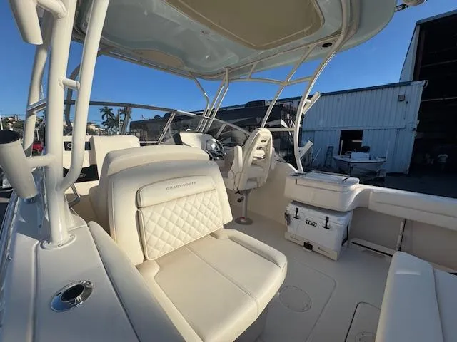 Yacht Photos Pics 2025 Grady-White Freedom 235 boat interior with luxurious seating and helm station.