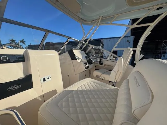  Yacht Photos Pics 2025 Grady-White Freedom 235 boat interior with luxurious seating and modern dashboard.