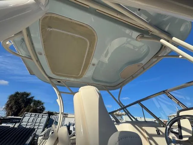  Yacht Photos Pics 2025 Grady-White Freedom 235 boat interior with canopy, under clear blue sky.