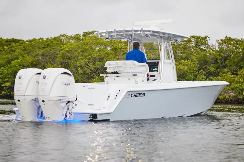  Yacht Photos Pics 2026 Contender 32 ST boat with dual Yamaha engines on calm water.