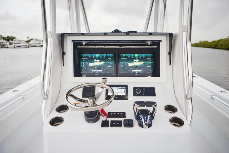  Yacht Photos Pics 2026 Contender 32 ST boat dashboard with dual screens and modern controls.