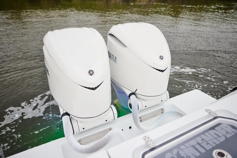  Yacht Photos Pics Twin Yamaha outboard engines on a 2026 Contender 32 ST boat in water.