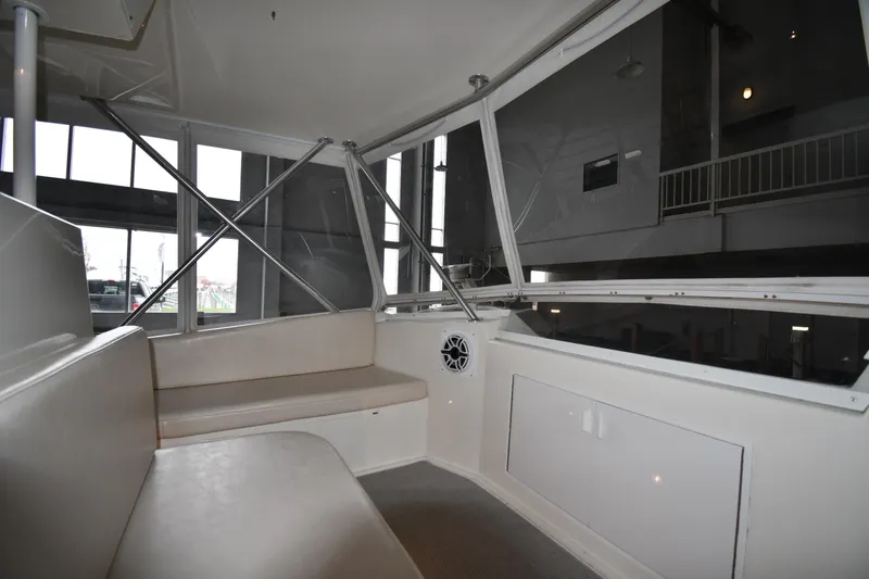 Your Rent's Due Yacht Photos Pics Interior of 1996 Viking 50 Convertible yacht with seating and windows.