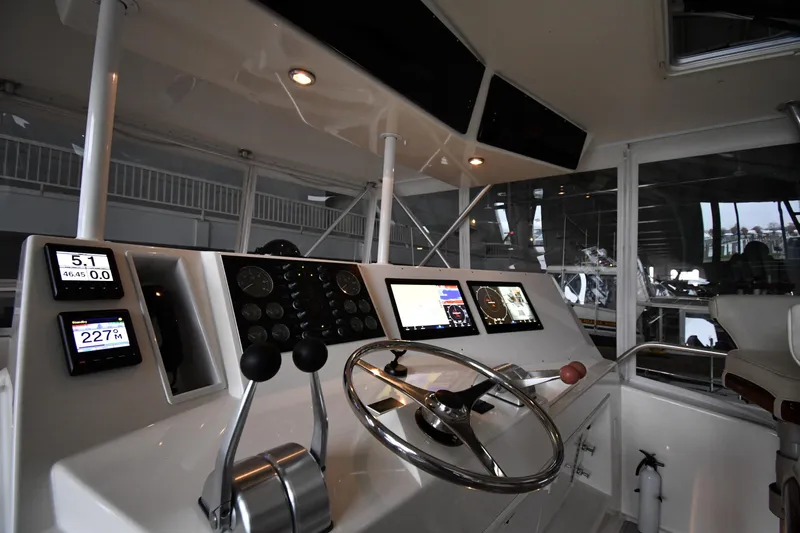 Your Rent's Due Yacht Photos Pics Control panel of a 1996 Viking 50 Convertible yacht with modern navigation instruments.