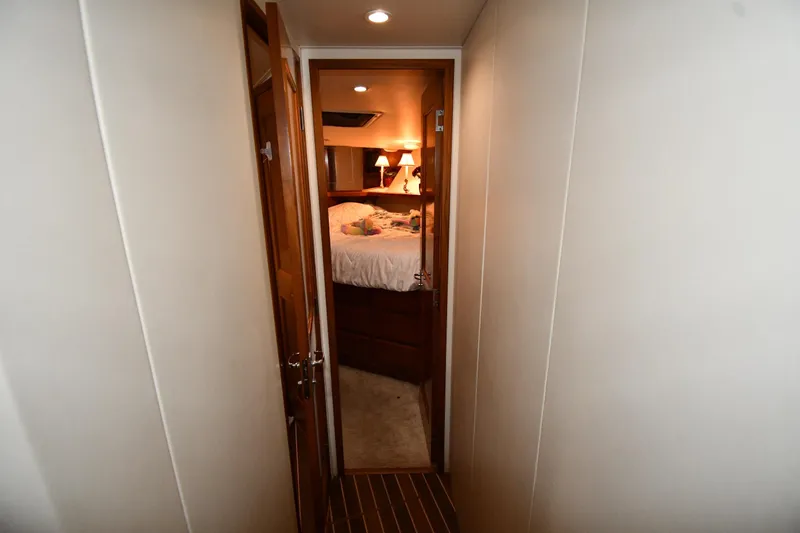 Your Rent's Due Yacht Photos Pics Hallway leading to cozy bedroom on 1996 Viking 50 Convertible yacht.