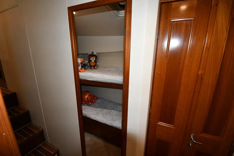 Your Rent's Due Yacht Photos Pics Bunk beds with toys in 1996 Viking 50 Convertible yacht cabin.