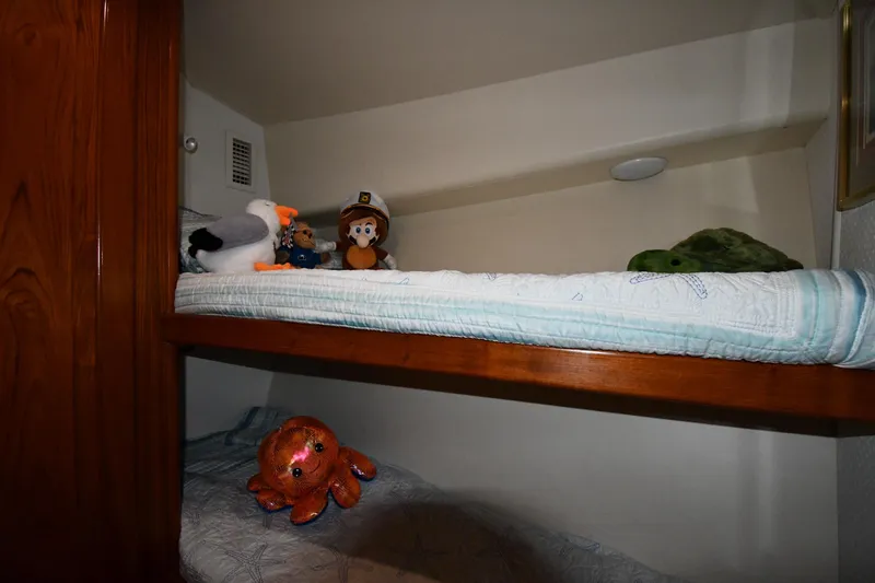 Your Rent's Due Yacht Photos Pics Bunk beds with plush toys on a 1996 Viking 50 Convertible yacht.