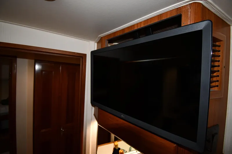 Your Rent's Due Yacht Photos Pics Flat-screen TV mounted in a 1996 Viking 50 Convertible yacht interior.