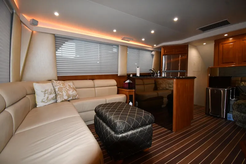 Your Rent's Due Yacht Photos Pics Luxurious interior of a 1996 Viking 50 Convertible yacht with elegant seating and modern amenities.