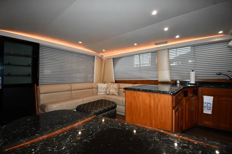 Your Rent's Due Yacht Photos Pics Luxurious interior of 1996 Viking 50 Convertible yacht with modern lighting and elegant furnishings.