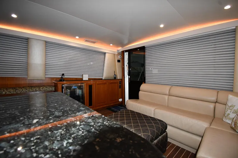 Your Rent's Due Yacht Photos Pics Luxurious interior of 1996 Viking 50 Convertible yacht with leather seating and modern amenities.