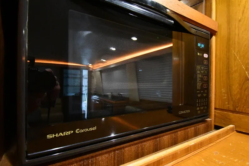 Your Rent's Due Yacht Photos Pics Sharp Carousel microwave in 1996 Viking 50 Convertible yacht kitchen.