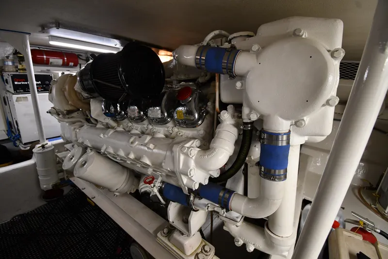 Your Rent's Due Yacht Photos Pics Engine room of a 1996 Viking 50 Convertible yacht, showcasing detailed machinery.