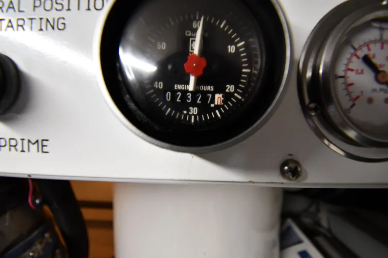 Your Rent's Due Yacht Photos Pics Close-up of engine hour meter on 1996 Viking 50 Convertible boat dashboard.