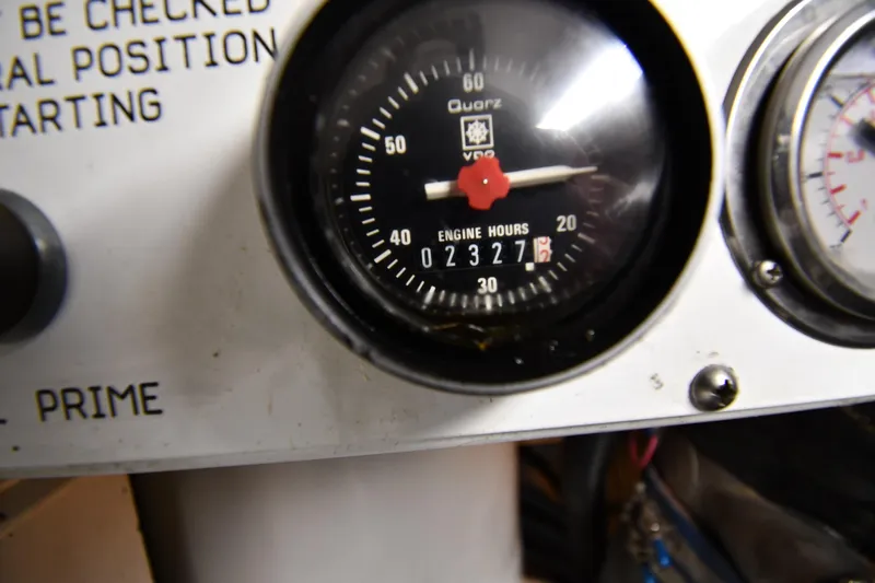 Your Rent's Due Yacht Photos Pics Engine hour meter on 1996 Viking 50 Convertible, showing 2327 hours.