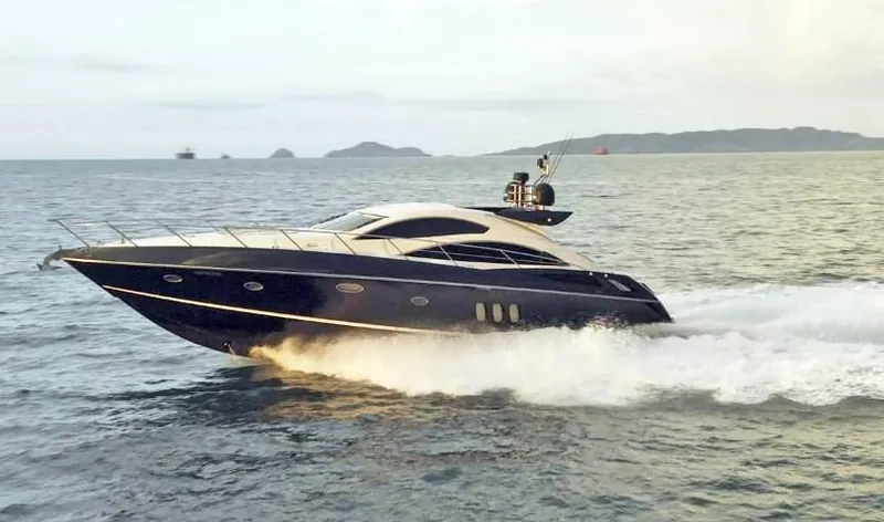  Yacht Photos Pics 2008 Sunseeker Predator 62 yacht cruising on open water.