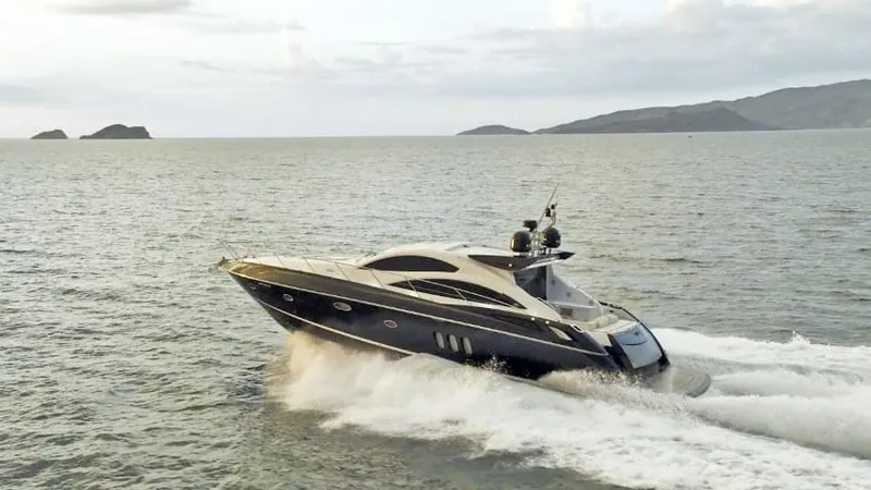  Yacht Photos Pics 2008 Sunseeker Predator 62 yacht cruising on open water.