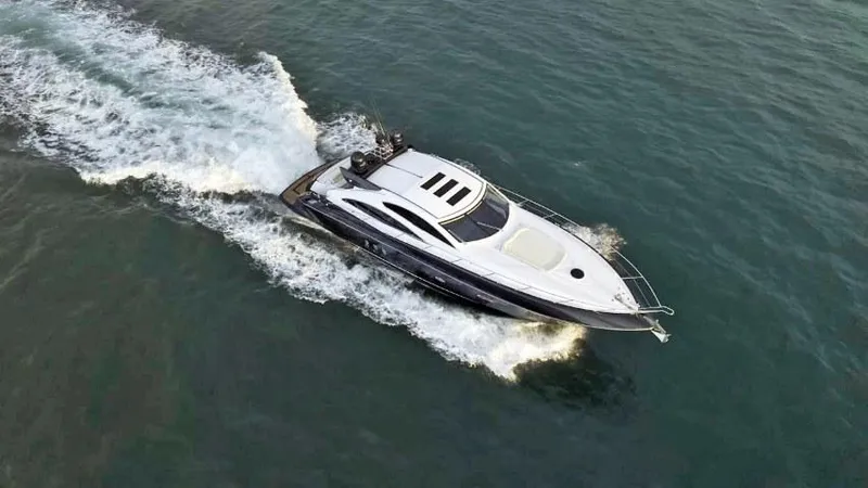  Yacht Photos Pics 2008 Sunseeker Predator 62 yacht cruising on open water.